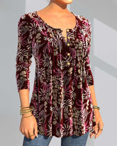 Blommönster topp med delad hals